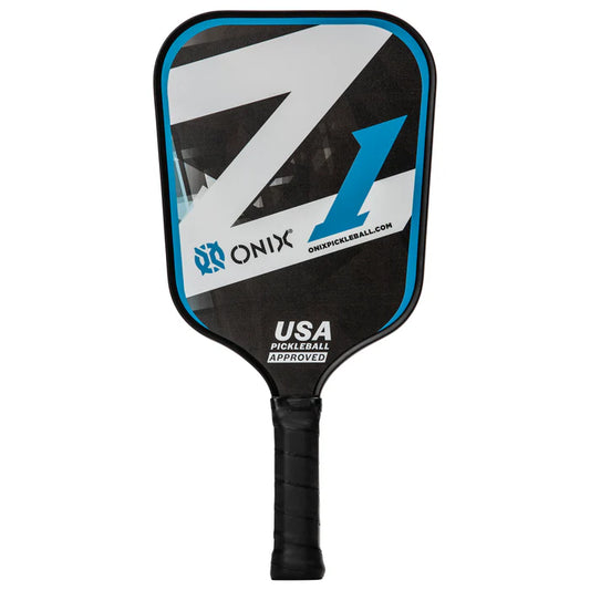 The Composite Z1 Pickleball Paddle by Onix, ideal for beginners, features a composite fiber face paired with a black grip and showcases a striking blue and white angled design. Adorned with the Onix logo, it is proudly certified as USA Pickleball approved.