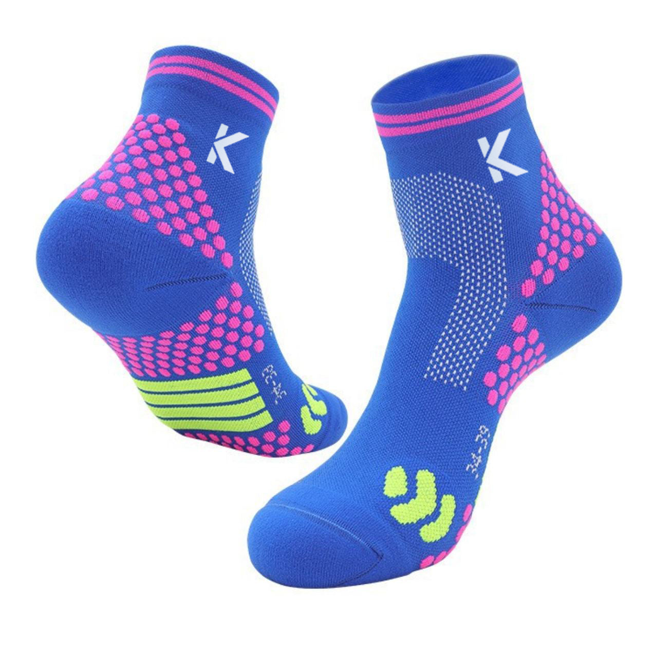 Introducing the Klyng Achilles Support High Performance Compression Socks: a vibrant pair of blue athletic socks adorned with pink and lime green patterns, featuring a white logo near the ankle. Perfect for pickleball players, these socks boast a design of dots and curved lines that exude sporty charm while delivering essential ankle support.