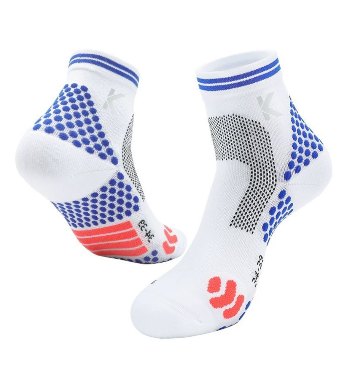 Introducing the Klyng Achilles Support High Performance Compression Socks, a pair of white athletic socks featuring blue and black grip patterns around the ankles and soles. Designed specifically for pickleball players, these socks offer gentle compression support. The heel area is enhanced with red grip accents, and convenient small size markings are located near the toes.