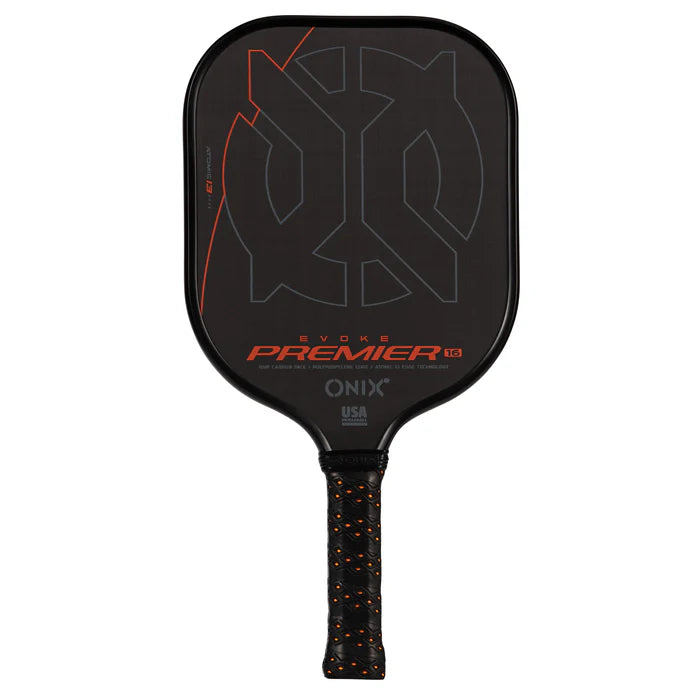 The Evoke Premier Pro Raw Carbon Pickleball Paddle by Onix is a lightweight option featuring a black design with orange details on its carbon fiber surface. The face is adorned with the words "Evoke Premier" and "Onix," while the handle includes a black grip accented with orange.