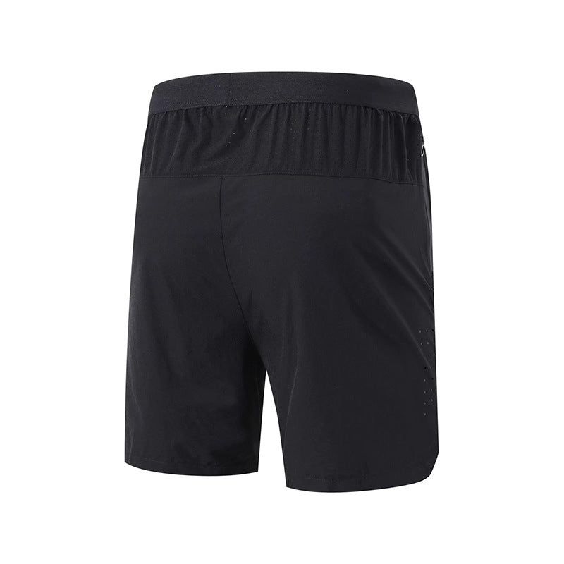 A back view of a pair of black FlexPro Pickleball Shorts from Klyng, featuring an elastic waistband. The lightweight fabric is designed with moisture-wicking properties and small perforations on one side for enhanced breathability, making them perfect for pickleball enthusiasts.