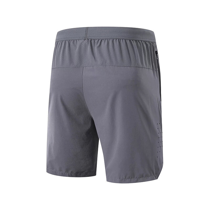 Klyng's FlexPro Pickleball Shorts, available in gray, come with an elastic waistband and a small zip pocket on the back. Made from lightweight, moisture-wicking fabric, these shorts are ideal for sports like pickleball or for casual wear.