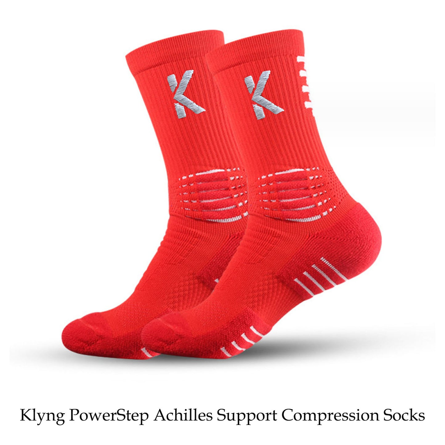 Klyng's PowerStep Achilles Support Compression Socks, featuring red fabric with white text and cushioning details, are ideal for pickleball enthusiasts. The image highlights two socks standing together, showcasing the reinforced heel and toe areas.