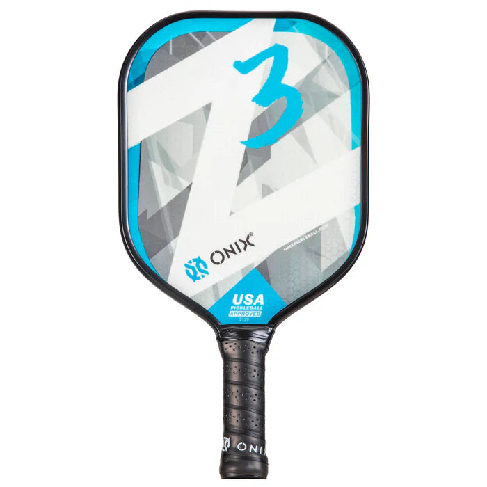 Introducing the Z3 Pickleball Paddle from Onix, featuring a composite face with a striking blue, white, and gray geometric design highlighted by the number 3. Its wide body shape proudly displays the Onix logo and the USA Pickleball Approved label. The paddle's black handle has a textured grip to ensure superior control.