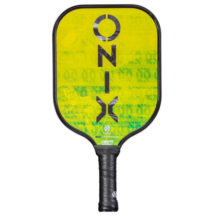 The Graphite React Pickleball Paddle showcases the ONIX brand prominently on its yellow and green face. Designed with a black handle and border, this paddle incorporates Fusion Core technology to boost its performance on the court.