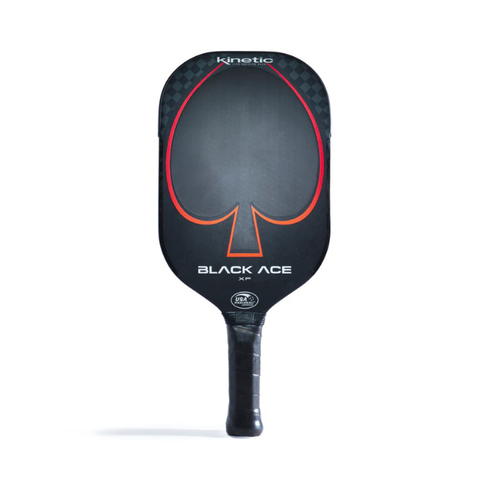 The Prokennex Black Ace XF Pickleball Paddle boasts a sleek black, elongated design highlighted by a striking red spade artwork and prominently displays "Black Ace XF" on the face, capturing the essence of a kinetic paddle. Its handle is skillfully wrapped in black grip tape for superior control and comfort.