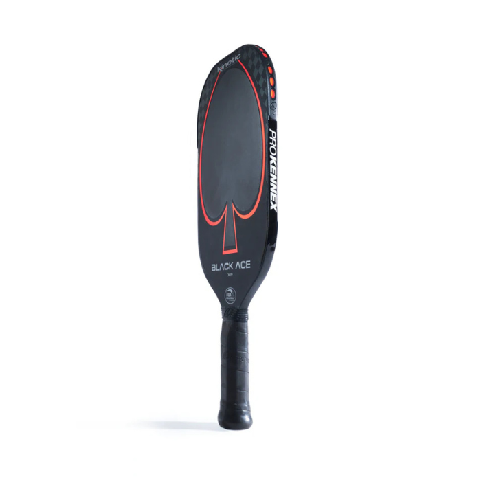 The Black Ace XF Pickleball Paddle from Prokennex showcases a striking and powerful design, highlighted by an elongated face adorned with a red outline of an ace of spades. With the name BLACK ACE prominently displayed, the paddle also features the brand Prokennex vertically on its side and is equipped with a black grip handle to ensure optimal control.