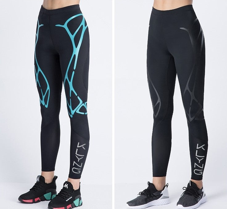 Two individuals wear black Women’s PowerFlex Pickleball Compression Pants by Klyng, featuring CourtTech Technology for superior muscle support. The pair on the left displays teal abstract patterns, while the one on the right boasts subtle gray designs. Both are styled with sneakers and stand against a plain white background.