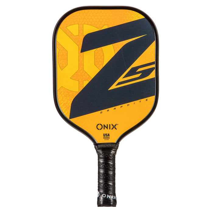 The Graphite Z5 v3 Pickleball Paddle by Onix, in yellow and black, boasts a textured grip with a tennis-style handle. Its prominent black Z design is highlighted on the surface, along with the Onix logo at the bottom. Ideal for players looking for high-quality pickleball paddles.