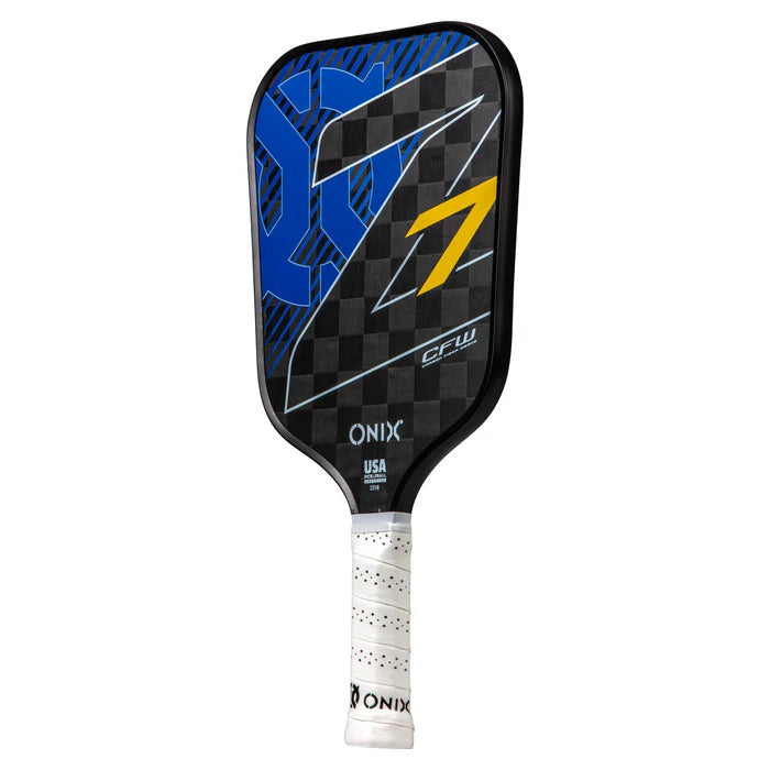 The Graphite Z7 v2 Pickleball Paddle, approved by USA Pickleball, features a checkered black surface with a striking blue design and a yellow number 7. Made from lightweight carbon fiber, it has a handle wrapped in white grip tape and prominently displays the Onix branding near the base for exceptional performance.