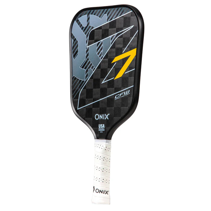 The image features the Graphite Z7 v2 Pickleball Paddle by Onix, displaying a checkered black and gray pattern with a yellow number 7. This USA Pickleball Approved paddle is crafted from lightweight carbon fiber and includes a white, perforated grip handle.