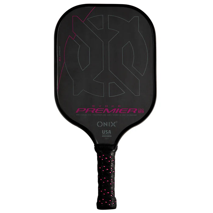 The Evoke Premier Pro Raw Carbon Pickleball Paddle by Onix features a lightweight build with a striking pink and gray geometric design on its carbon fiber surface. The paddle prominently displays the words "Evoke Premier" and "Onix USA." Its handle is wrapped in a black grip accented with pink for added flair.