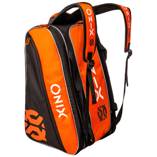 The Pro Team Paddle Pickleball Bag by Onix is a black and orange sports backpack made from durable polyester. This versatile bag includes multiple compartments, adjustable straps, zippered pockets, and features the Onix branding prominently across various sections of the bag.