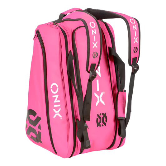 The Onix Pro Team Paddle Pickleball Bag, in a vibrant pink color, is constructed from durable polyester and features contrasting black straps and detailing. It showcases the Onix branding in white and includes practical zippered pockets to keep your gear organized efficiently.