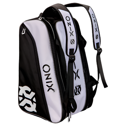 The Onix Pro Team Paddle Pickleball Bag in black and white is ideal for use as a pickleball bag, featuring the well-known ONIX branding. Made from sturdy polyester, it includes multiple compartments and zippered pockets, along with padded shoulder straps for added comfort.